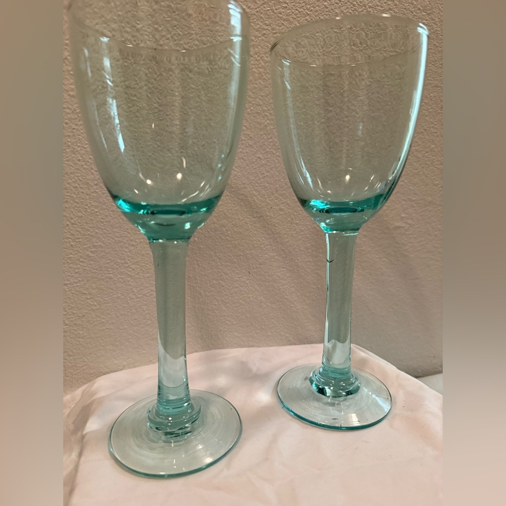 2 aqua blue hand blown glasses.